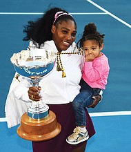 Tennis star Serena Williams holds both her daughter, Alexis Olympia Ohanian Jr., and the ASB trophy after winning the singles title last Sunday at the ASB Classic, also known as the Auckland Classic, in New Zealand.