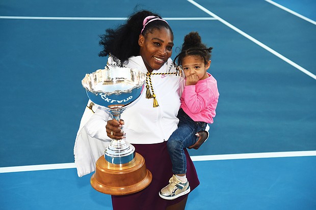 Tennis star Serena Williams holds both her daughter, Alexis Olympia Ohanian Jr., and the ASB trophy after winning the singles title last Sunday at the ASB Classic, also known as the Auckland Classic, in New Zealand.