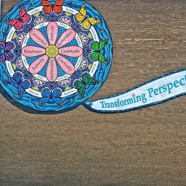 A mural created by artist Colleen Phelon Hall for the nonprofit Senior Connections tells its story of “empowering older adults and persons with disabilities to live with dignity and choice.” The mural dominates one side of the Downtown headquarters of the agency at 24 E. Cary St. Senior Connections, the Capital Area Agency on Aging, was born 46 years ago as an outgrowth of the 1973 federal Older Americans Act. Largely supported with federal, state and local funding, the agency serves as an advocacy, resource and service center to enable seniors and the disabled to live as independently as possible. The agency also serves to support the caretakers of senior citizens. Part of a national network, Senior Connections serves residents in the city and seven surrounding counties — Henrico, Hanover, Chesterfield, Charles City, New Kent, Goochland and Powhatan.