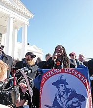 Antonia Okafor of Texas addresses the crowd inside Capitol Square, where guns were not allowed. She was the sole African-American speaker at the rally.