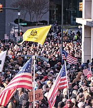 Thousands of demonstrators crowd Bank Street in Downtown, waving flags and signs during the Lobby Day rally by gun rights activists at the State Capitol on the Martin Luther King Jr. Holiday.