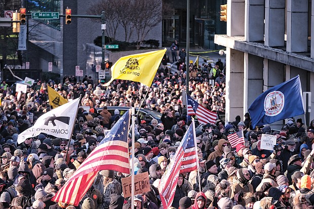 Thousands of demonstrators crowd Bank Street in Downtown, waving flags and signs during the Lobby Day rally by gun rights activists at the State Capitol on the Martin Luther King Jr. Holiday.