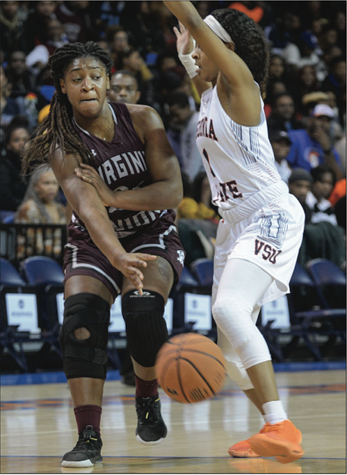 Virginia Union University senior guard Kishona Sutton, left, passes the ball around Autumn Hopson of Virginia State University during last Saturday’s matchup at the 25th Annual Freedom Classic.