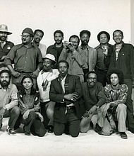 Henrico native Louis Draper, kneeling center, poses with fellow photographers in this Kamoinge group portrait from 1973 by photographer Anthony Barboza.