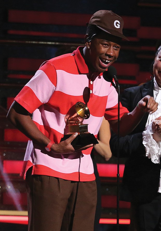 Tyler, the Creator accept the Grammy Award for best rap album for “Igor” during the ceremony televised from the Staples Center.