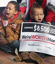 Kenneth Henderson II, 4, left, and Zachary Watters, 3, lend their voices to a rally for more state funding for teachers and public education on Monday at the bell Tower at Capitol Square in Downtown. The youngsters were attending the “Fund Our Future” rally with their mothers, Anasa Johnson and Ashleigh Watters, who are teachers with Richmond Public Schools and Petersburg Public Schools, respectively.