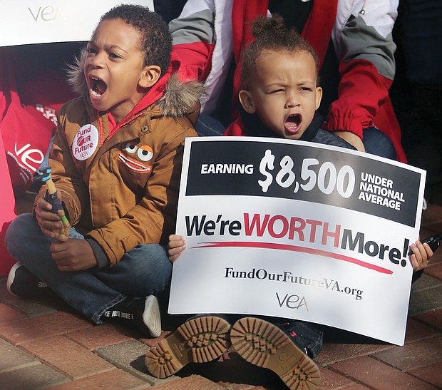 Kenneth Henderson II, 4, left, and Zachary Watters, 3, lend their voices to a rally for more state funding for teachers and public education on Monday at the bell Tower at Capitol Square in Downtown. The youngsters were attending the “Fund Our Future” rally with their mothers, Anasa Johnson and Ashleigh Watters, who are teachers with Richmond Public Schools and Petersburg Public Schools, respectively.