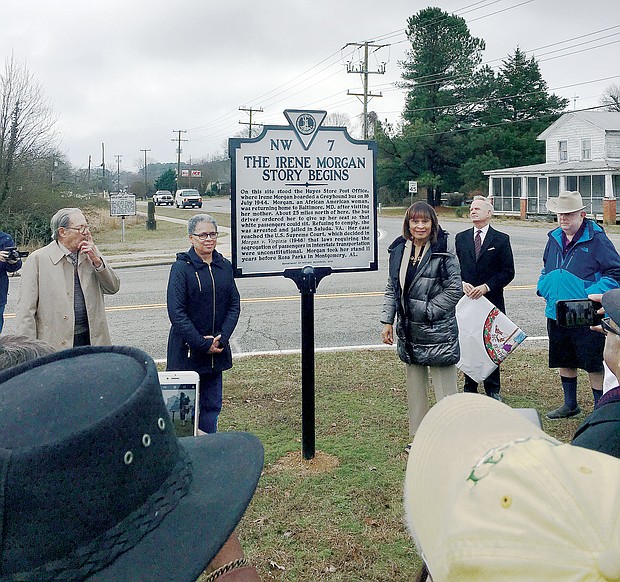 Irene A. Morgan’s niece, Cleo Warren, center left, and daughter, Brenda M. Bacquie, unveil the historic marker last Saturday in Hayes. With them are from left, Ben Borden, a longtime Hayes resident, and Jim Hare, director of the survey and register division of the Virginia Department of Historic Resources.