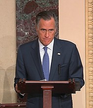 U.S. Sen. Mitt Romney of Utah is solemn Wednesday as he announces that he will break with his fellow Republicans and vote to convict President Trump on one of the two articles of impeachment.