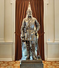 A statue of Confederate Gen. Robert E. Lee stands near the entrance to the Old House Chamber at the State Capitol. The chamber also features the busts of six other Confederate leaders.