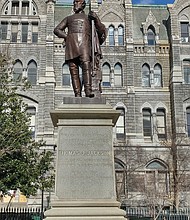 A statue of Confederate Gen. Thomas J. “Stonewall” Jackson stands on the grounds of Capitol Square along a walkway between the Capitol and Old City Hall.