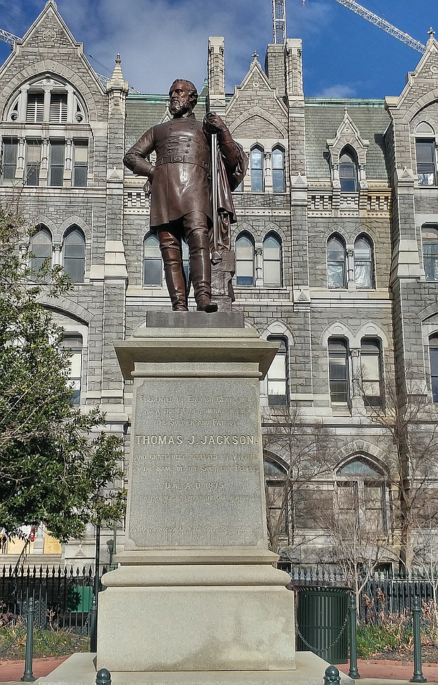 A statue of Confederate Gen. Thomas J. “Stonewall” Jackson stands on the grounds of Capitol Square along a walkway between the Capitol and Old City Hall.