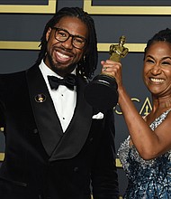 Matthew A. Cherry and Karen Rupert Toliver show off their Oscars awarded for best animated short film for “Hair Love” during last Sunday’s Academy Awards ceremony in Los Angeles.