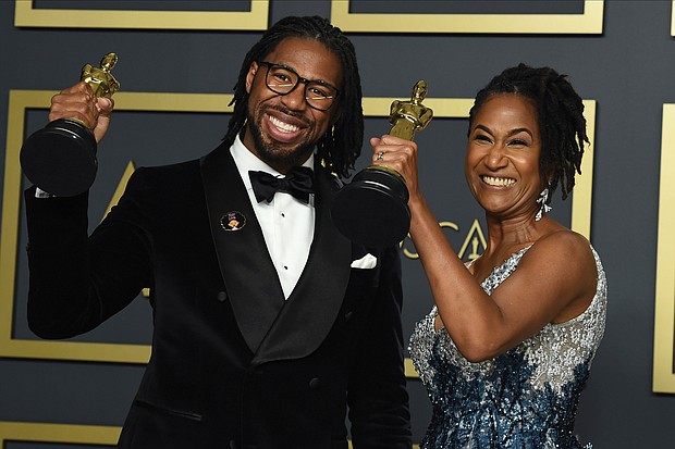 Matthew A. Cherry and Karen Rupert Toliver show off their Oscars awarded for best animated short film for “Hair Love” during last Sunday’s Academy Awards ceremony in Los Angeles.