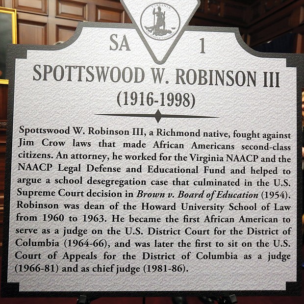 This is the marker to Mr. Hill’s late law partner, Judge Robinson, who went on to break color barriers in the federal court system and rise to become chief judge of the powerful U.S. Court of Appeals for the District of Columbia. Mr. Hill and Judge Robinson played key roles in the landmark 1954 Brown v. Board of Education decision by the U.S. Supreme Court that struck down government-sanctioned racial segregation of public schools and led to other landmark civil rights laws.