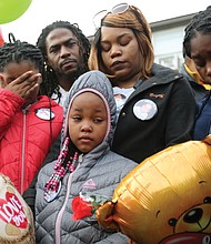 Shamar's grieving family joins mourners at the vigil — parents Sharmar Hill Sr. and Shaniqua Allen, center rear; and sisters, from left, Len’Naveya Smith, 10; Len’Niesha Smith, 7; and Ni’Aveya Allen, 14. The youngster’s death has touched the community, with hundreds of people, including Gov. Ralph S. Northam, Mayor Levar M. Stoney and Richmond Police Chief Will Smith, attending his funeral Monday at New Life Deliverance Tabernacle on Decatur Street. No arrest has been made yet in the youngster’s death.