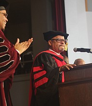 Delegate Luke e. Torian of Prince William County, right, receives a standing ovation following his keynote address last Friday at Virginia union university’s 155th Anniversary Founders Day Convocation. Joining in the applause is Vuu President Hakim J. Lucas.