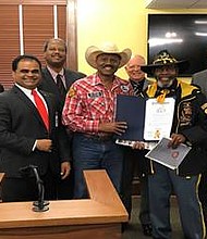 Fort Bend County Judge K.P George along with members of Commissioners Court, Larry Callies of the Black Cowboy Museum in Rosenberg,  and Edward G. Udell, Sr. of the Buffalo Soldiers National Museum in Houston.