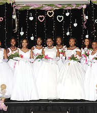 After participating in workshops and activities for several months, the Alpha Kappa Alpha Sorority’s debutantes are presented at a formal ball with the theme, “A Pink and Green Ball with Hearts of Gold.”