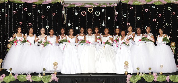 After participating in workshops and activities for several months, the Alpha Kappa Alpha Sorority’s debutantes are presented at a formal ball with the theme, “A Pink and Green Ball with Hearts of Gold.”