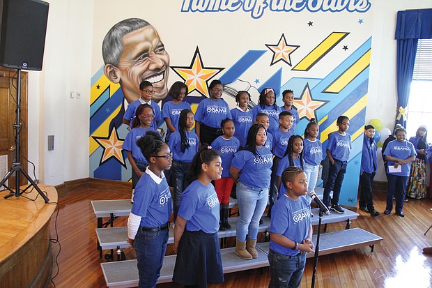 The Barack Obama Celebration Choir sings an original song, “O,” about the former president during last Friday’s dedication ceremony. A mural by Richmond artist Hamilton Glass is behind them.