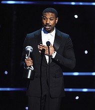 Michael B. Jordan accepts the award for best actor in a motion picture for his role as crusading Harvard-educated attorney Bryan Stevenson in the movie “Just Mercy.” The film’s co-star, Jamie Foxx, won an Image Award for best supporting actor.