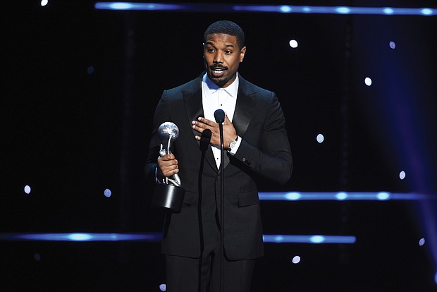 Michael B. Jordan accepts the award for best actor in a motion picture for his role as crusading Harvard-educated attorney Bryan Stevenson in the movie “Just Mercy.” The film’s co-star, Jamie Foxx, won an Image Award for best supporting actor.