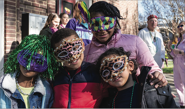 There’s nothing like a colorful mask and beads to get into the spirit of Mardi Gras. youngsters, from left, Kendall Lewis, 5; Qaiden Lewis, 6; Mekiyan Clanton, 11; and Khalil Abraham, 4, are ready for the festivities last Saturday at Dogtown Dance Theatre’s 10th Annual Mardi Gras RVA, which kicked off with a parade.