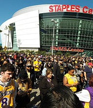 Many of the thousands of fans who attended Monday’s public remembrance event for the former Los Angeles Lakers star Kobe Bryant and his daughter, Gianna, dressed in the team colors of purple and yellow.
