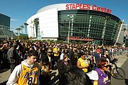 Many of the thousands of fans who attended Monday’s public remembrance event for the former Los Angeles Lakers star Kobe Bryant and his daughter, Gianna, dressed in the team colors of purple and yellow.