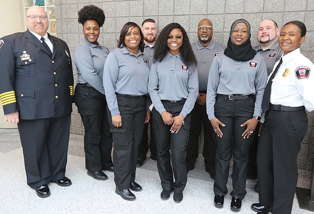 Seven new graduates of the Richmond Department of Emergency Communications’ 33rd Basic Dispatch Academy celebrate after a ceremony last Friday at the Richmond Police Training Academy. The new graduates are, from left, Stephanie Z. Franklin, Kyna Meadows, Joseph Kearns, Zakiya St. Dic, Woody Winborn, Safiyyah Muslima Bint Abdul Malik and Justin Fleming. They are flanked at left by Stephen M. Willoughby, director of the Department of Emergency Communications, and at right by Ortoria Hymons, the department’s acting training supervisor. The graduates began their training on Jan. 6 with classroom sessions on dispatch procedures, public safety terminology, handling difficult callers and active shooter situations and fires, and various policies and procedures. They practiced answering 911 emergency calls, rode along with Richmond Police officers and passed several tests to make it to graduation. Now they must complete hundreds of hours of on-the-job training before they can work independently taking 911 calls and dispatching help.