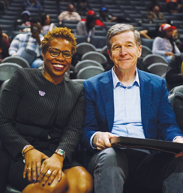 CIAA Commissioner Jacqueline McWilliams and North Carolina Gov. Roy Cooper are on the sidelines at the Spectrum Center during the tournament. The CIAA was celebrating its 75th anniversary this year.