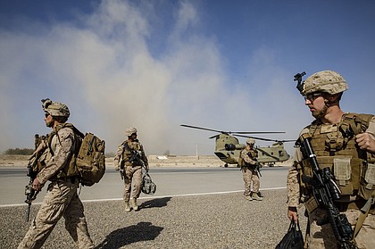 U.S. Marines disembark from a U.S. Army helicopter at Camp Bost in Afghanistan’s Helmand Province, on Oct. 29, 2017