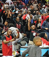 Rams fans raise the roof at the Spectrum Center in Charlotte, N.C., as the Winston-Salem State team pulls out a victory in the final minutes of the championship game.