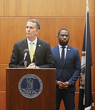 Gov. Ralph S. Northam offers the latest information on the coronavirus and its impact in the state during a news conference Wednesday at the Patrick Henry Building. At the briefing, the governor’s second in a week, he was surrounded by a bevy of state health, hospital and other officials, including Mayor Levar M. Stoney.