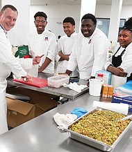 Chef Jean-Marc Tachet of Lyon, France, slices goose liver Sunday as students in Richmond Public Schools’ culinary program watch closely. The students are, from left, Nicholas Pollard, Jaquan Washington, Jadyn Colden and Jameisha Rush. Location: Hatch Kitchen RVA in South Side. The side counter features the makings for truffle soup, one of five courses served at Monday evening’s benefit for the culinary program at the Richmond Technical Center.