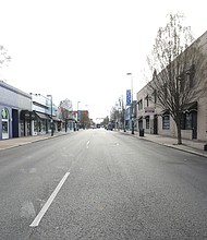 Carytown looks deserted Tuesday morning. This stretch of Cary Street between Belmont
and Sheppard streets, is typically filled with cars. Due to the coronavirus pandemic and
requirements for social distancing, this is the new normal for retail districts around the
country and the world.