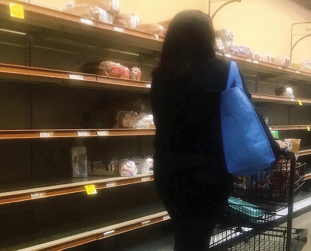 Shelves are bare in area grocery stores across the city and beyond Friday. “This is like a Christmas rush on steroids, yet at Christmas we are prepared for the crowds and long lines,” one shopper commented.