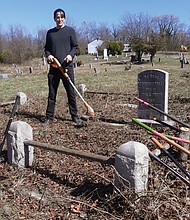 Dr. John Slavin gets ready for more weed whacking at private Woodland Cemetery in Henrico County. He has been volunteering every Sunday for 18 months to help clear overgrown grass, vines and trees and restore the historic, private African-American cemetery that dates to 1916.