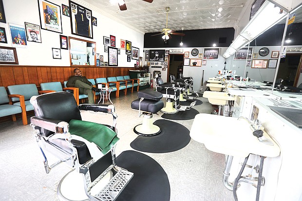 Marvin Smith, 52, hopes for customers at his shop, The Barbershop on2, at 420 N. 2nd St. in Jackson Ward. He only allows one customer in at a time and sanitizes everything regularly.