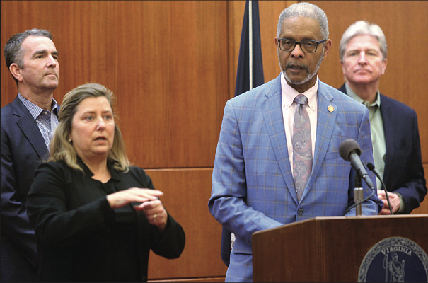 Dr. M. Norman Oliver provides updates on Virginia’s response to the spread of coronavirus as Gov. Ralph S. Northam, left, looks on. Location: The Patrick Henry Building at Capitol Square on March 18 during Gov. Northam’s daily briefing for reporters.