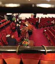 Dr. Rodney D. Waller conducts the 11 a.m. service Sunday in a largely empty sanctuary at First African Baptist Church in North Side. Following the guidelines, only 10 people were allowed to attend, with other congregants able to watch a live stream at their homes.