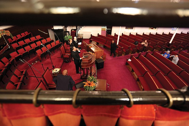 Dr. Rodney D. Waller conducts the 11 a.m. service Sunday in a largely empty sanctuary at First African Baptist Church in North Side. Following the guidelines, only 10 people were allowed to attend, with other congregants able to watch a live stream at their homes.