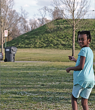 With school out and a breeze blowing, Noelle Sharp, 9, takes advantage of a sunny day to
fly a kite last Friday in Byrd Park. The youngster was with her family at the park, the wide open spaces allowing for social distancing and fun.