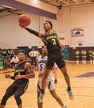 Jordan Parham of Huguenot High School goes up for a basket during the Falcons’ game against James River High School on Feb. 7.