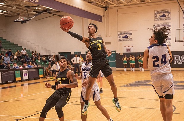 Jordan Parham of Huguenot High School goes up for a basket during the Falcons’ game against James River High School on Feb. 7.