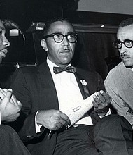 The Rev. Joseph E. Lowery, center, sits with Dr. Martin Luther King Jr., left, and Dr. Wyatt Tee Walker at First African Baptist Church in Richmond during a Southern Christian Leadership Conference convention in September 1963.