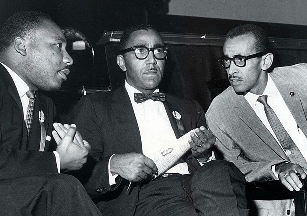 The Rev. Joseph E. Lowery, center, sits with Dr. Martin Luther King Jr., left, and Dr. Wyatt Tee Walker at First African Baptist Church in Richmond during a Southern Christian Leadership Conference convention in September 1963.