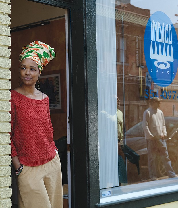 Ife Robinson, owner of Indigo salon, opens daily for consultations. Her son, Mansa, comes with her as part of their daily routine. “It helps to connect with people in some way,” she says.