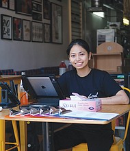Czarina Deguzman sits in the doorway of Soul Taco to take to-go orders. The restaurant on 2nd Street is one of Soul Taco’s two locations in Downtown.